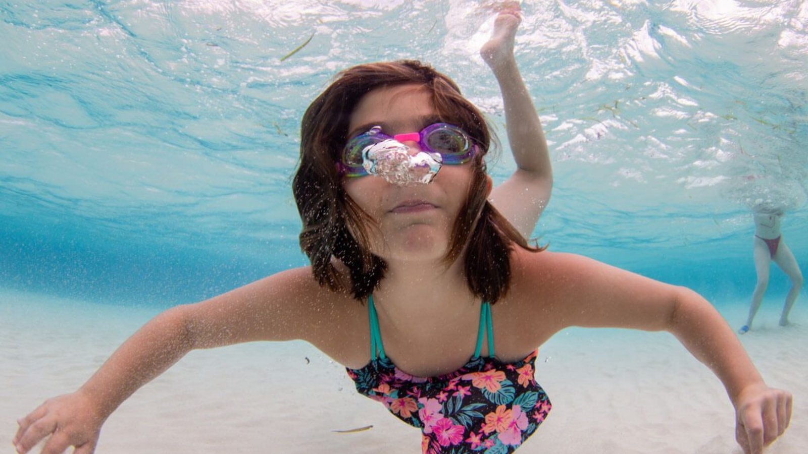 Kids playing on the beach after a day of watersports”