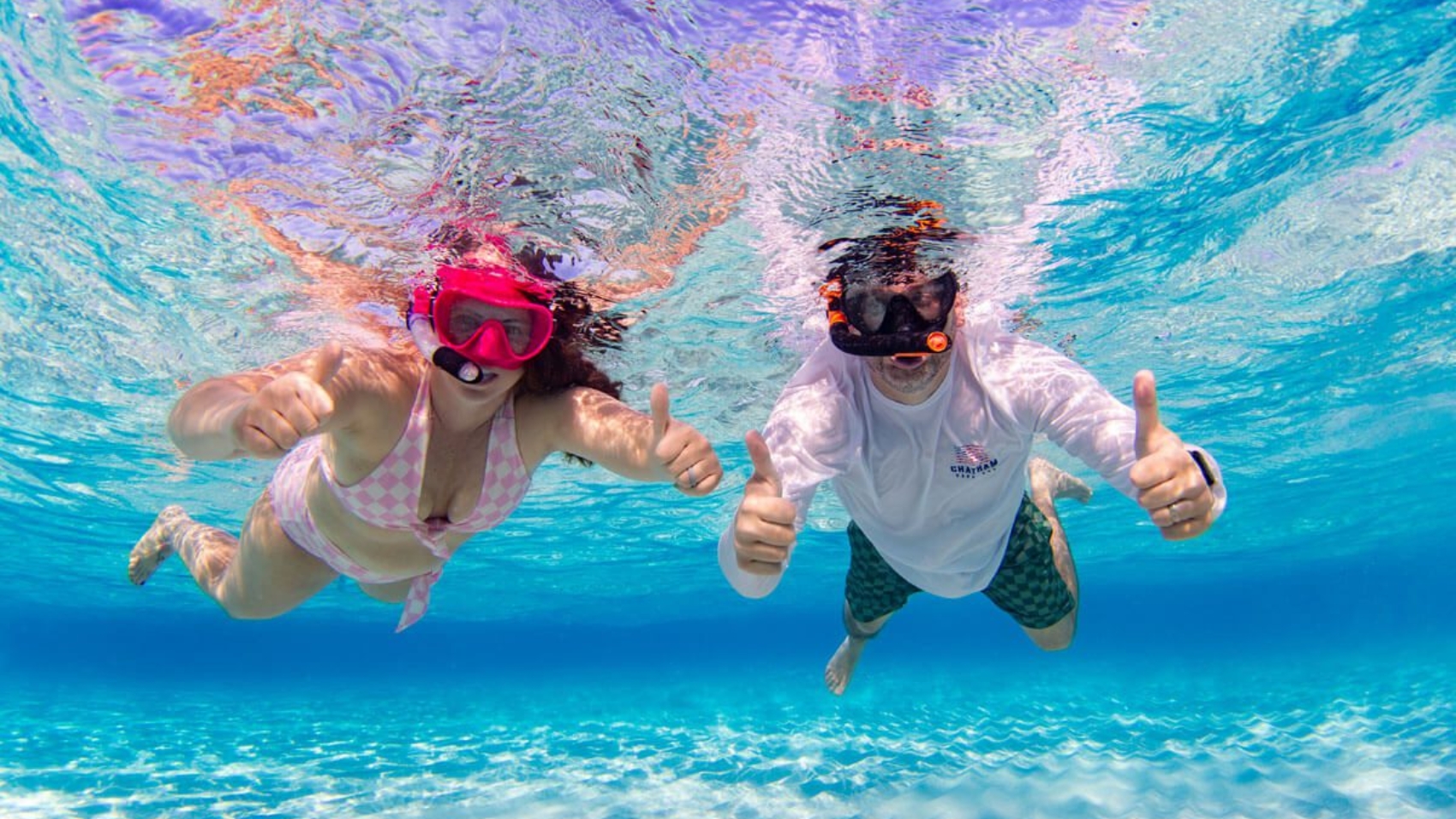 Snorkeler exploring crystal blue waters of Grand Cayman